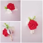 Prendido de novio con rosa roja y flores blancas