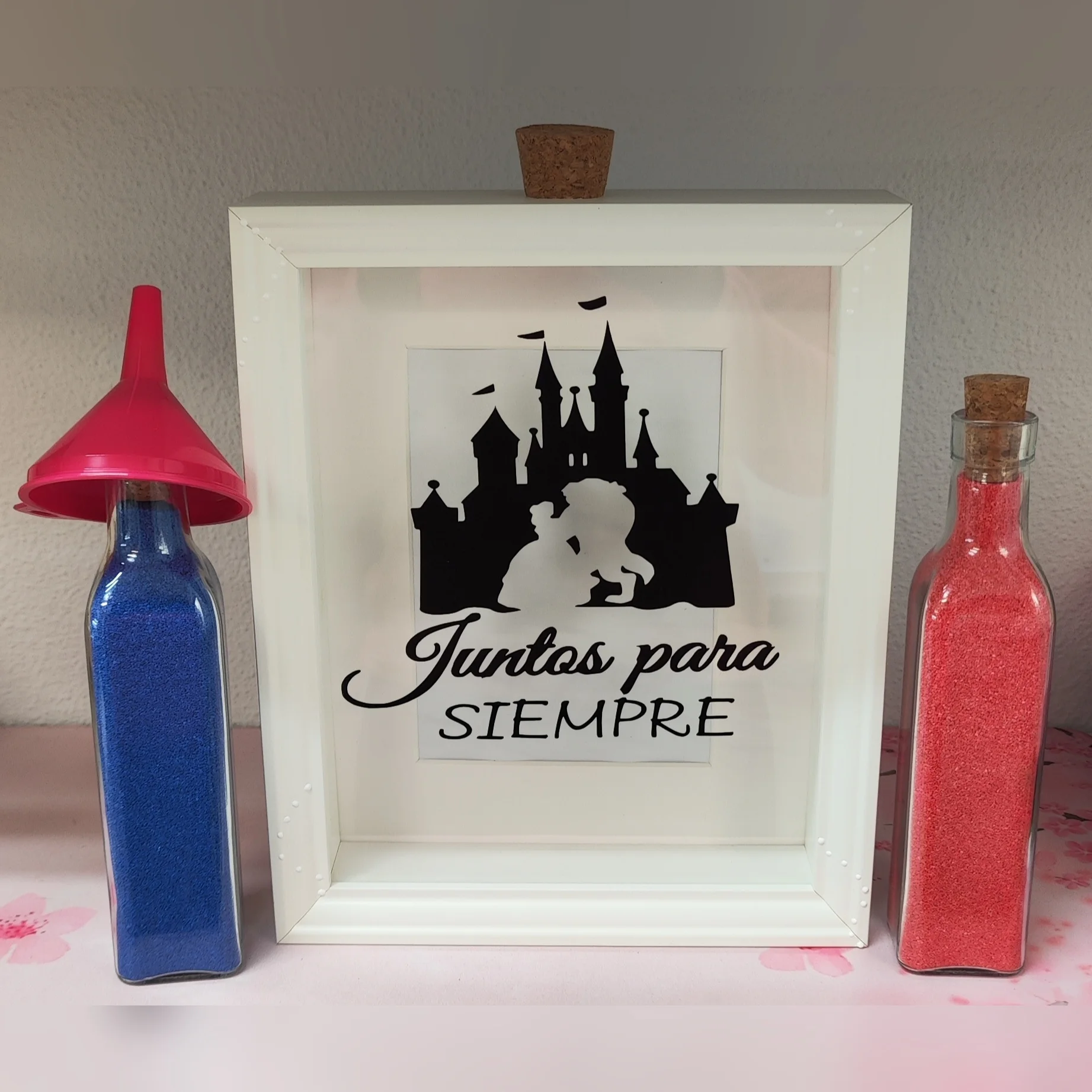 cuadro para ceremonia de la arena con castillo y pareja en silueta, frase juntos para siempre y dos botellas con arena
