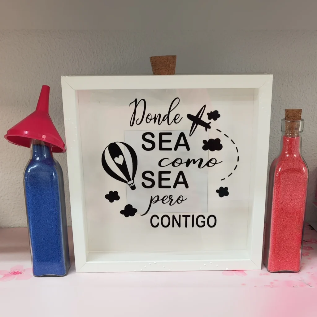 cuadro para ceremonia de la arena con globo aerostático y avión, frase donde sea como sea pero contigo y dos botellas con arena